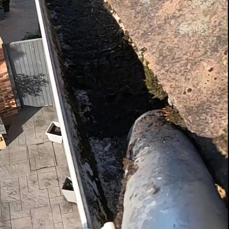 Before: Gutter clearing, sludge-filled run, Warrington